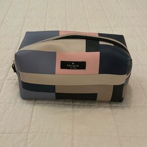 Kate Spade makeup bag. Fair condition. Blue, pink, and tan.